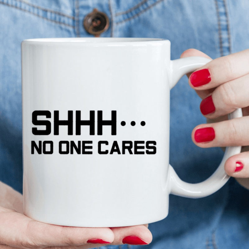 Tailorly White Ceramic 11 oz Mug - Shhh No One Cares Minimalist White Ceramic Vessel Displaying High Contrast Typography On Surface Mug