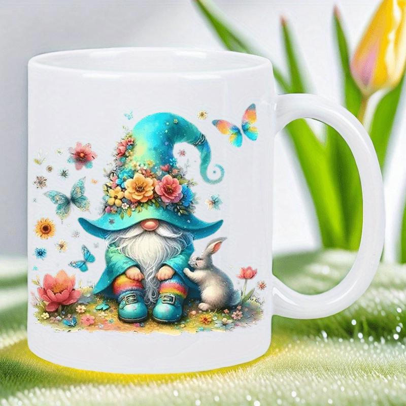 Tailorly White Ceramic 11 oz Mug - Whimsical Garden Illustration With Colorful Flowers And Butterflies Beside A Small Rabbit Gnome