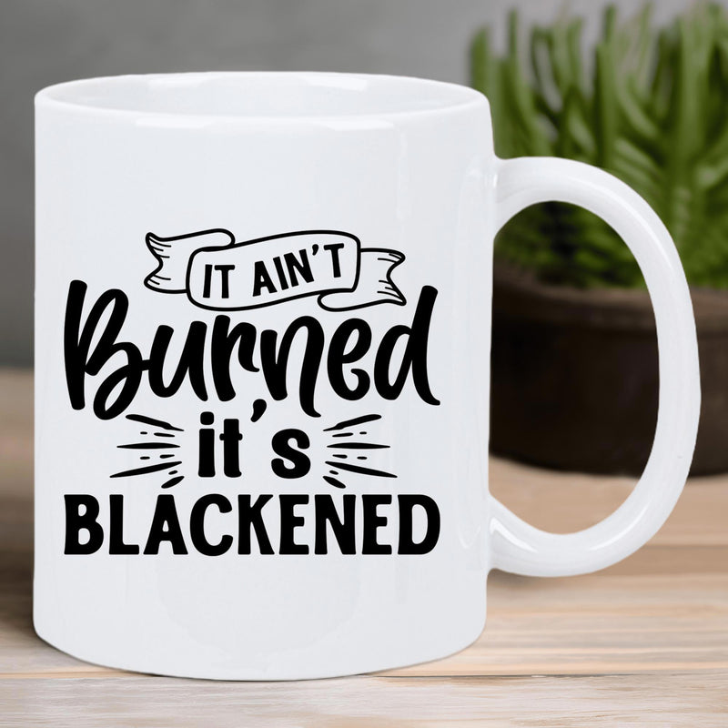 Tailorly White Ceramic 11 oz Mug - It Ain't Burned It's Blackened Stylized Decorative Ribbon Banner With Modern Bold Script Typography Mug