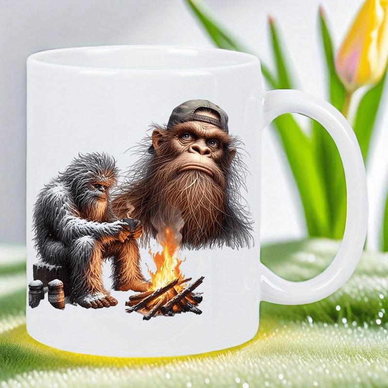 Tailorly White Ceramic 11 oz Mug - Detailed Furry Sasquatch Sitting Near Toasty Campfire Flame With Floating Head Bigfoot