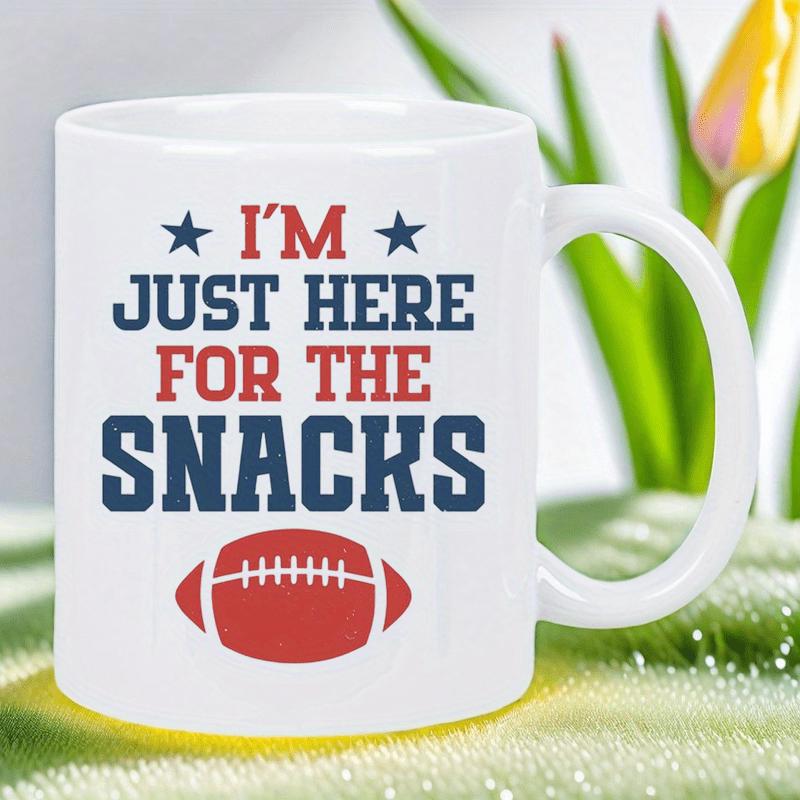 Tailorly White Ceramic 11 oz Mug - Im Just Here For The Snacks Classic Red American Football Positioned Under Bold Stars And Playful Text Football