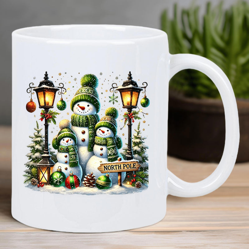 Tailorly White Ceramic 11 oz Mug - North Pole Smiling Family Of Snowmen Wearing Green Knitted Hats Among Lanterns Snowman