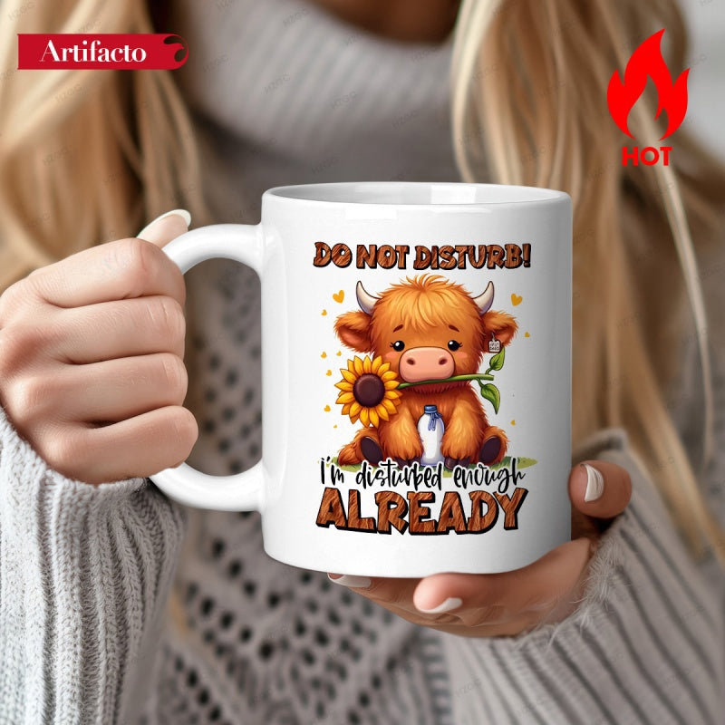 Tailorly White Ceramic 11 oz Mug - Do Not Disturb Im Disturbed Enough Already Adorable Fluffy Brown Highland Cow Holding A Radiant Yellow Sunflower Cow