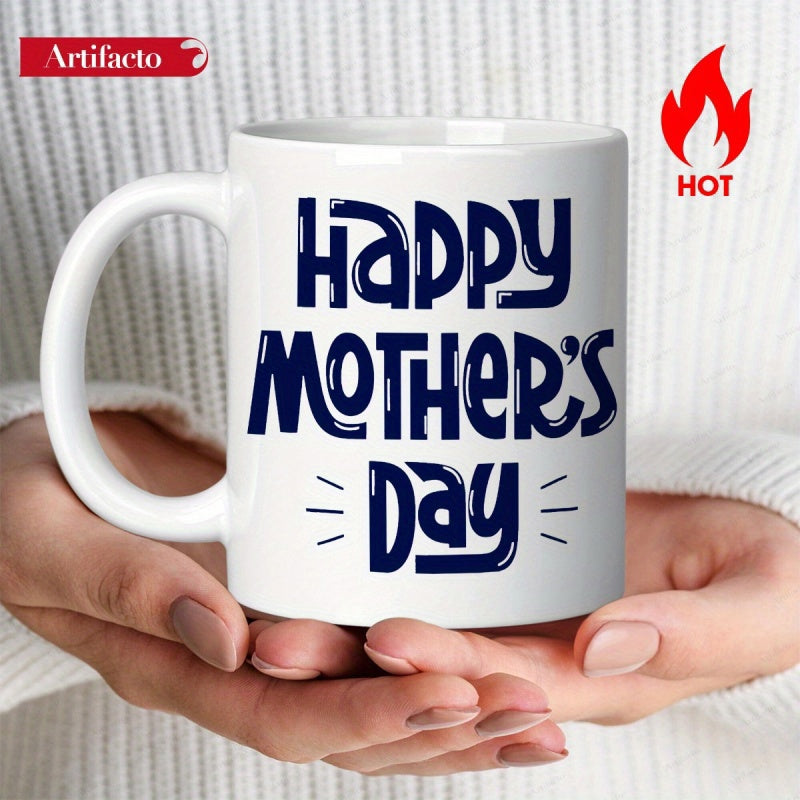 Tailorly White Ceramic 11 oz Mug - Happy Mothers Day Minimalist White Ceramic Vessel Held By Gentle Hands Against Knitted Texture Mug
