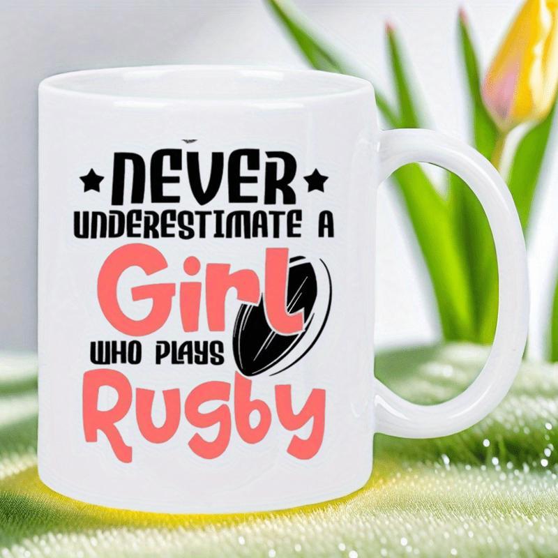 Tailorly White Ceramic 11 oz Mug - Never Underestimate A Girl Who Plays Rugby Bold Typography Featuring Small Stars And A Classic Oval Sport Ball