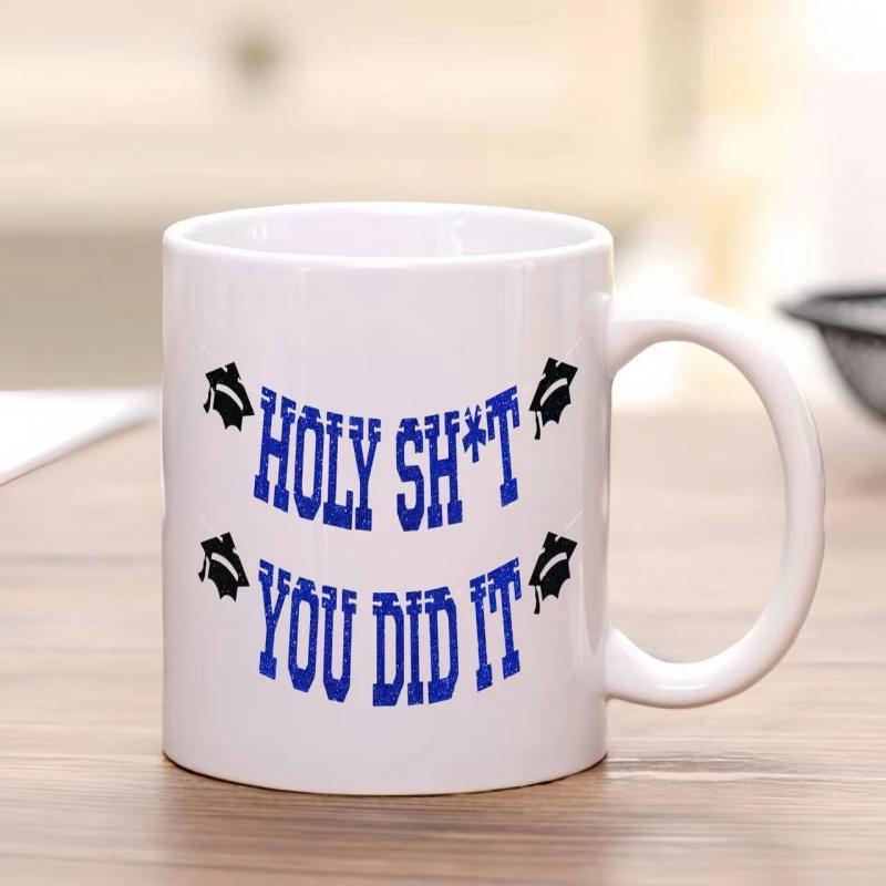 Tailorly White Ceramic 11 oz Mug - Holy Shit You Did It Graduation Cap Icons Surrounding Bold Blue Artistic Varsity Text Mug