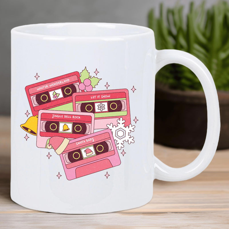 Tailorly White Ceramic 11 oz Mug - Retro Nostalgic Pink Music Tapes Floating Amidst Festive Winter Holiday Decorations Cassette