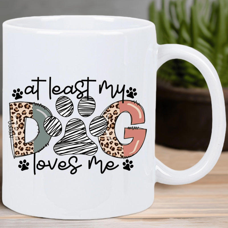 Tailorly White Ceramic 11 oz Mug - At Least My Dog Loves Me Artistic Leopard Print Design With Striped Paw Print And Heartfelt Script Dog