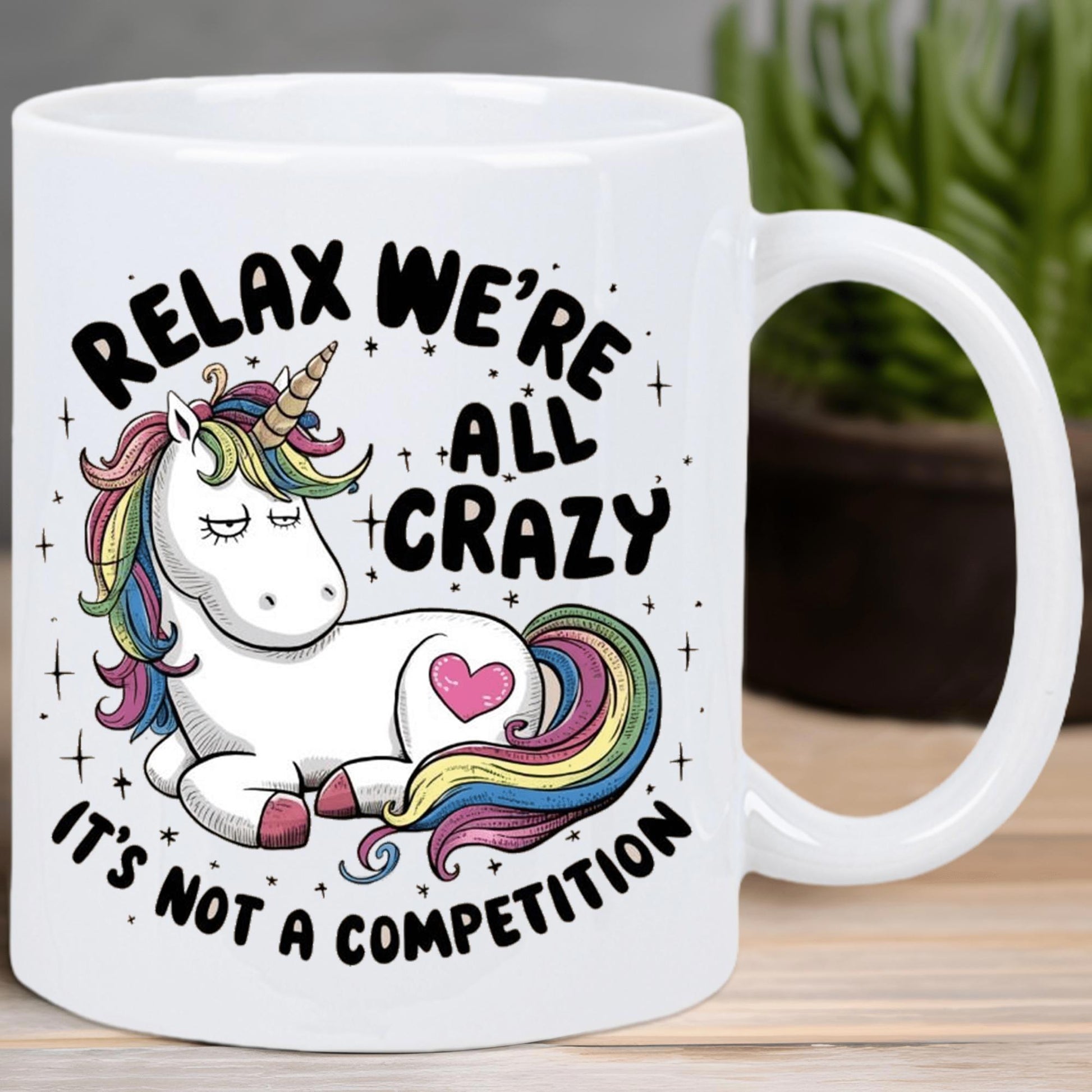 Tailorly White Ceramic 11 oz Mug - Relax Were All Crazy Its Not A Competition Resting White Mythical Creature With Rainbow Mane Tail And Heart Unicorn