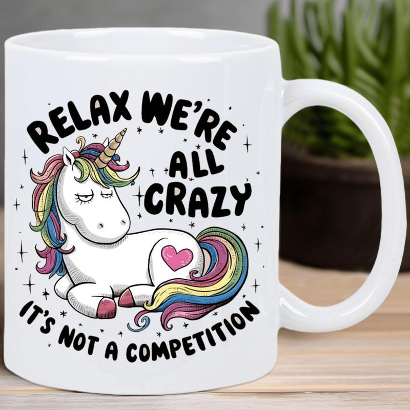 Tailorly White Ceramic 11 oz Mug - Relax Were All Crazy Its Not A Competition Resting White Mythical Creature With Rainbow Mane Tail And Heart Unicorn