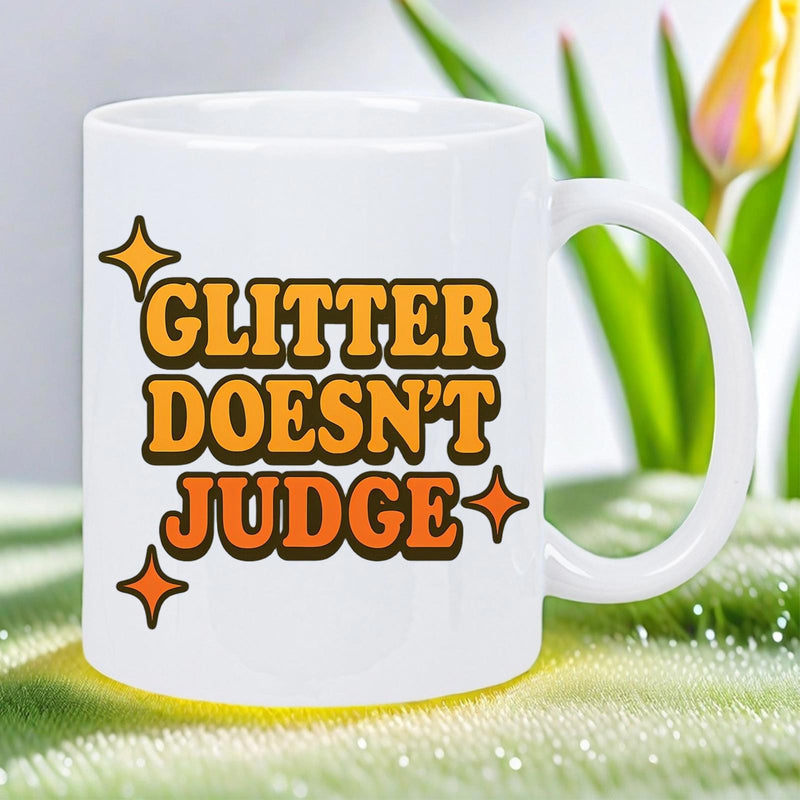 Tailorly White Ceramic 11 oz Mug - Glitter Doesn't Judge Retro Groovy Letters Surrounded By Four Pointed Orange Sparkling Stars Quote