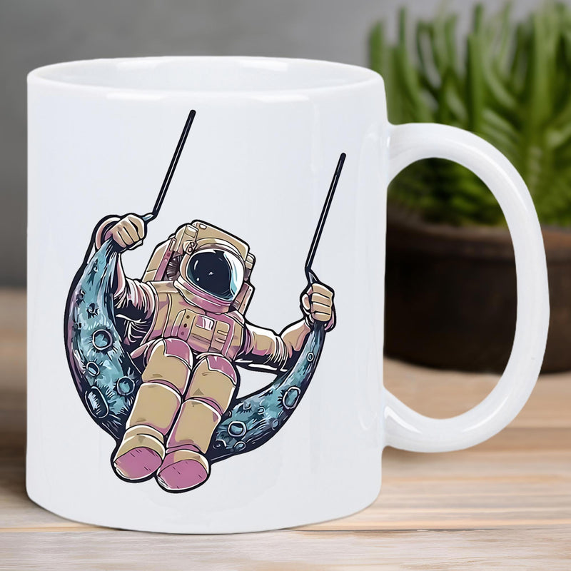 Tailorly White Ceramic 11 oz Mug - Adventurous Spaceman Sitting On A Textured Crescent Moon Swing Within Deep Space Astronaut