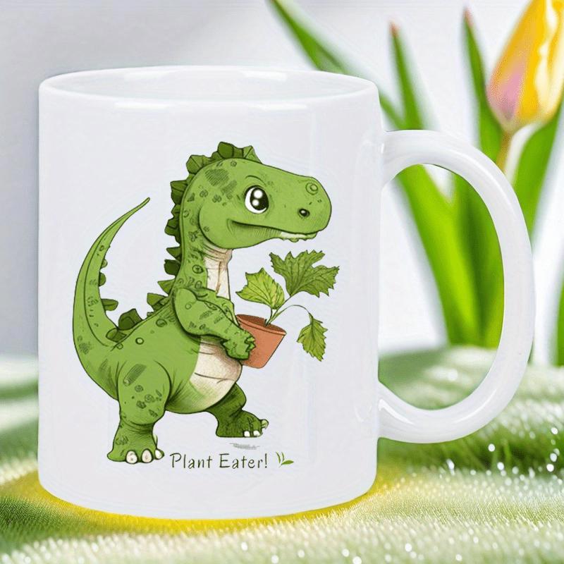 Tailorly White Ceramic 11 oz Mug - Plant Eater Friendly Green Cartoon Dinosaur Holding A Small Potted Plant With Leaves Dinosaur