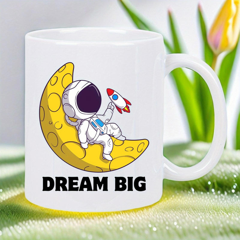 Tailorly White Ceramic 11 oz Mug - Dream Big Cute Cartoon Figure Resting On Yellow Crescent Moon Holding Rocket Astronaut