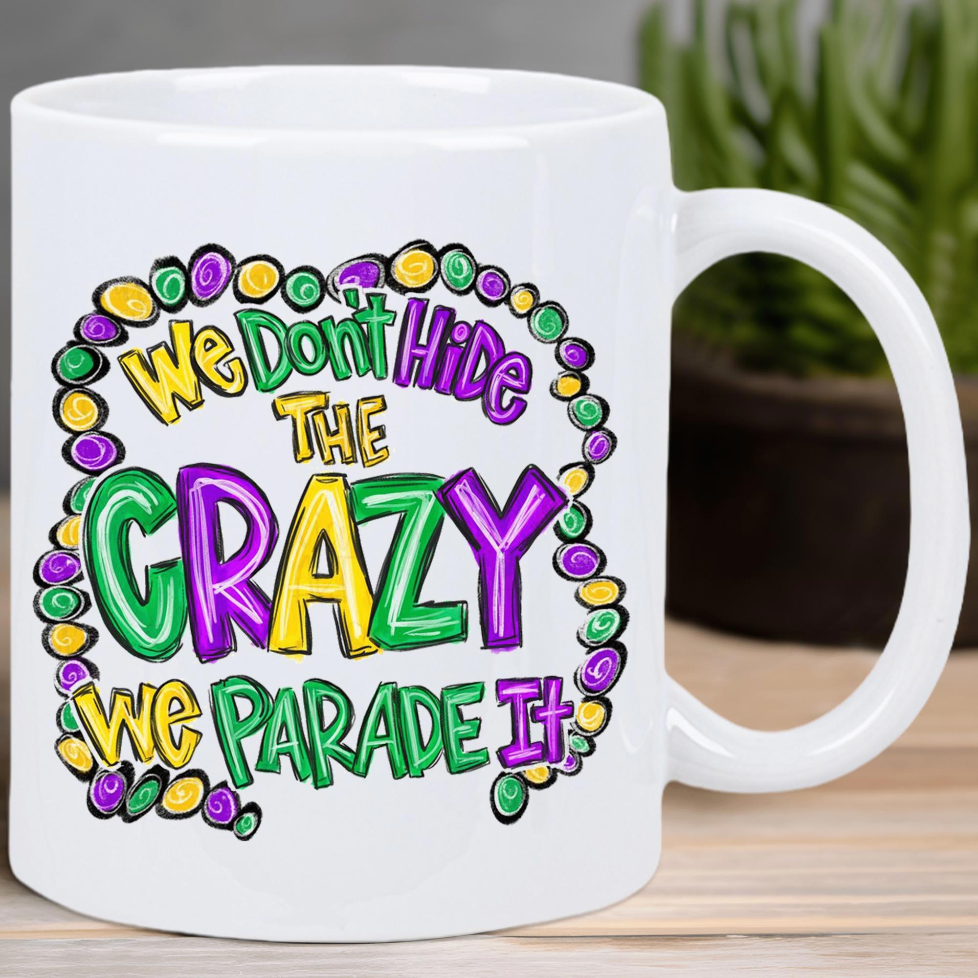 Tailorly White Ceramic 11 oz Mug - We Don't Hide The Crazy We Parade It Vibrant Purple Green And Yellow Festive Mardi Gras Party Style Pattern Beads