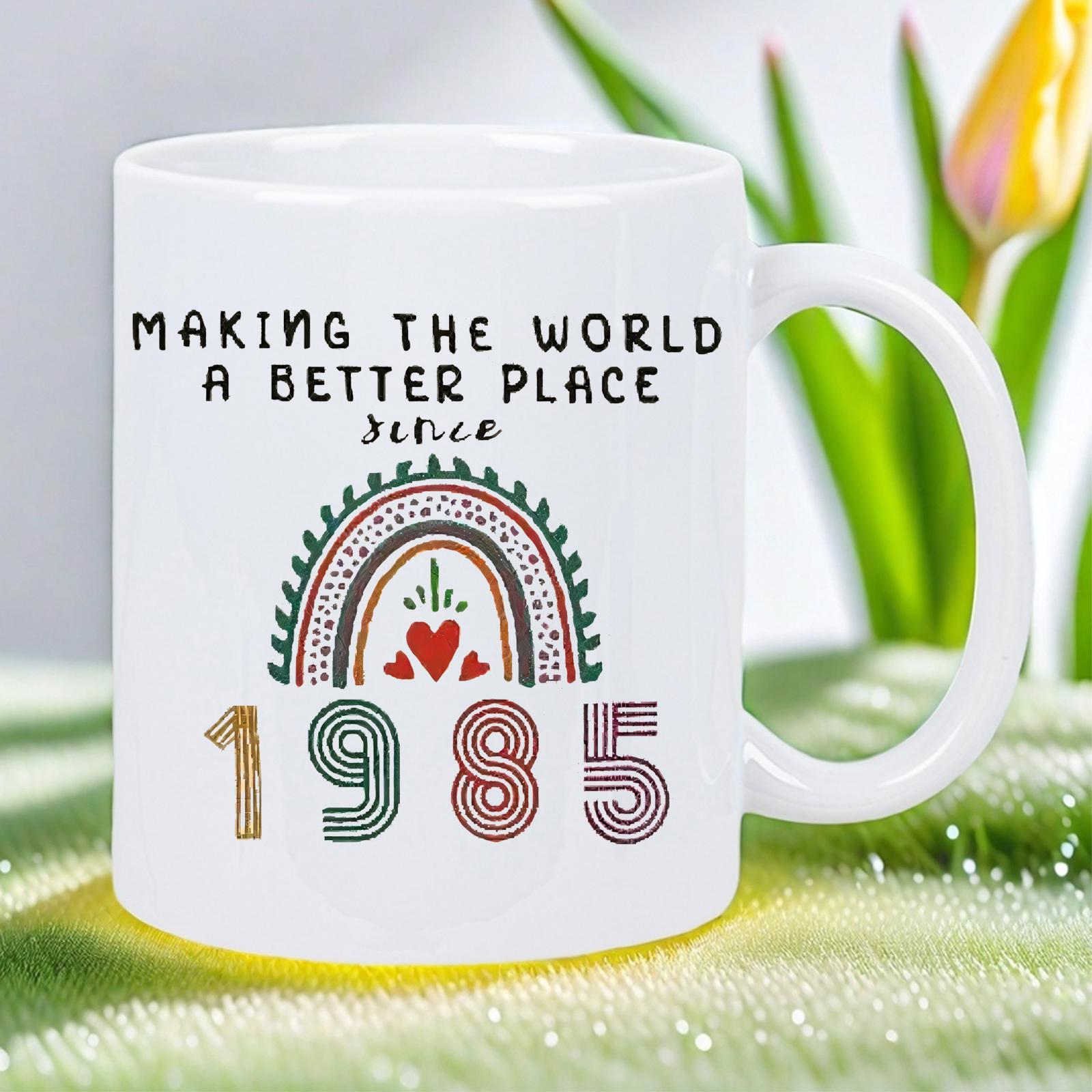 Tailorly White Ceramic 11 oz Mug - Making The World A Better Place Since 1985 Stylized Colorful Boho Rainbow Featuring Arches And A Central Heart Rainbow
