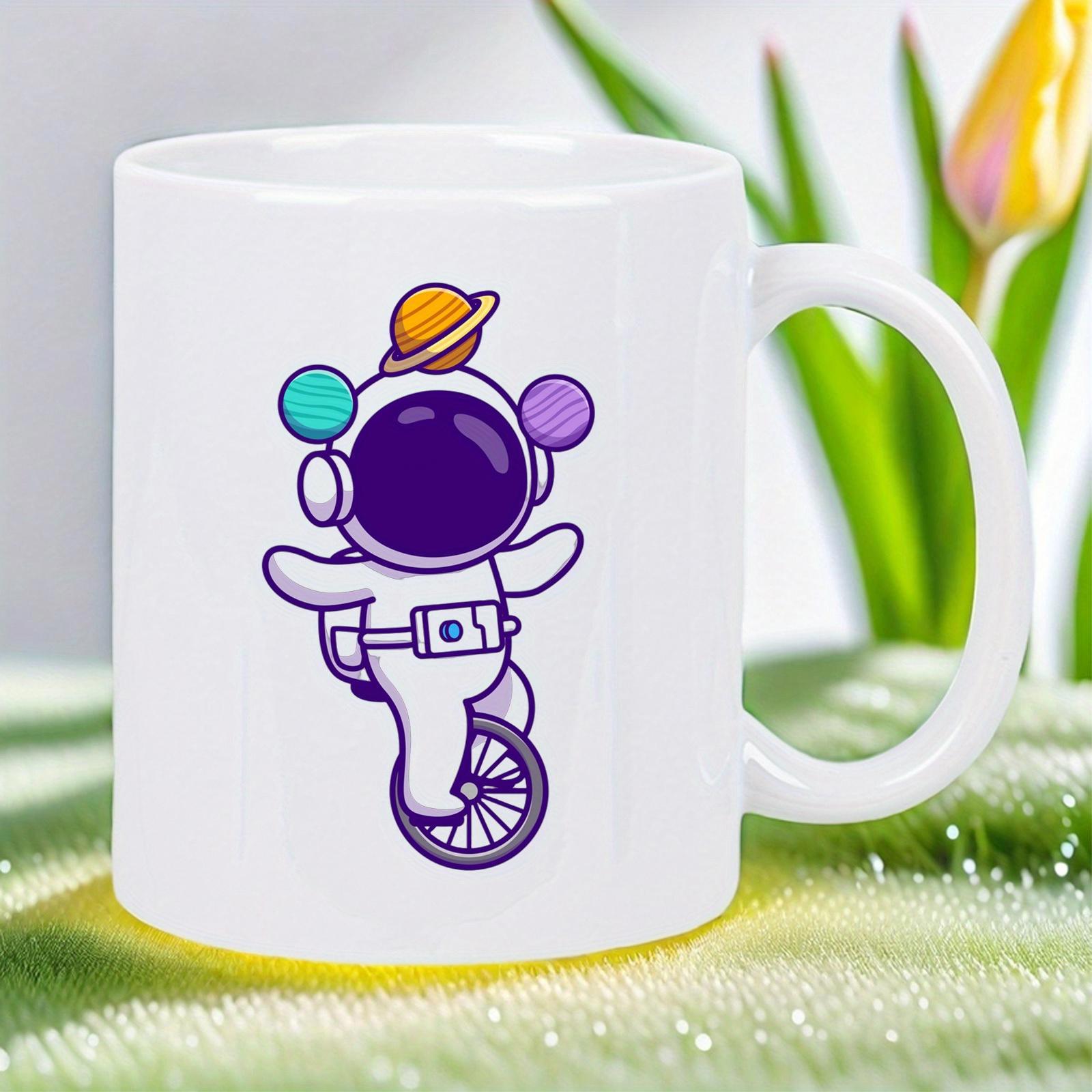 Tailorly White Ceramic 11 oz Mug - Whimsical Space Explorer Riding Unicycle Balancing Among Colorful Floating Cosmic Planets Astronaut