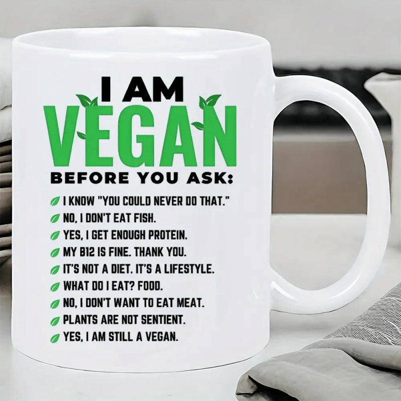 Tailorly White Ceramic 11 oz Mug - I Am Vegan Before You Ask Minimalist White Background Featuring Elegant Green Foliage And Bold Black Text Mug