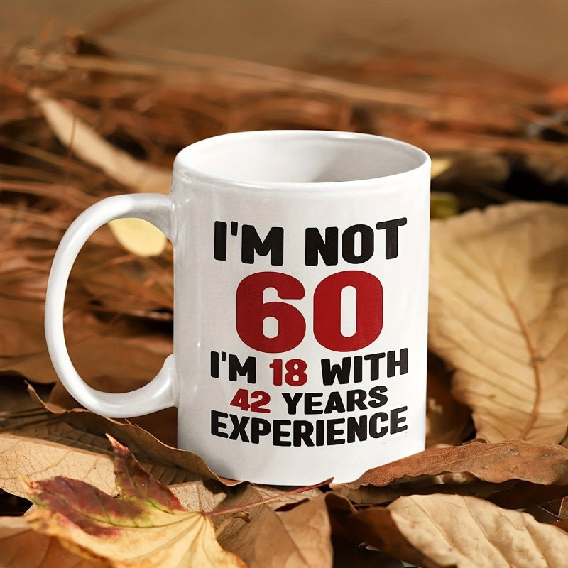 Tailorly White Ceramic 11 oz Mug - I'm Not 60 I'm 18 With 42 Years Experience Bold Typography Design Sitting Atop Natural Fallen Brown Autumn Leaves Mug