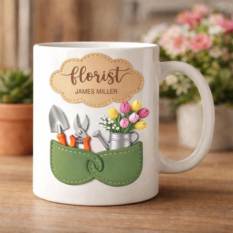 Tailorly White Ceramic 11 oz Mug - Florist James Miller Green Pockets Holding Hand Trowel And Watering Can With Tulips Mug