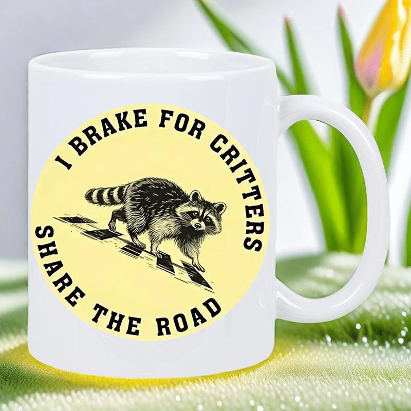 Tailorly White Ceramic 11 oz Mug - I Brake For Critters Share The Road Hand Drawn Wildlife Sketch Walking Across A Yellow Circular Road Raccoon