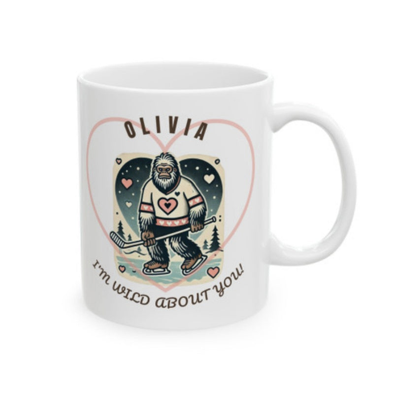 Tailorly White Ceramic 11 oz Mug - Olivia Im Wild About You Hairy Sasquatch Skating On Ice Holding Hockey Stick Inside Pink Heart Bigfoot