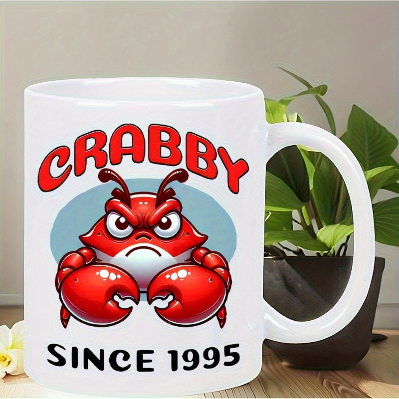 Tailorly White Ceramic 11 oz Mug - Crabby Since 1995 Vibrant Red Angry Crustacean With Large Claws Set Against Blue Oval Crab