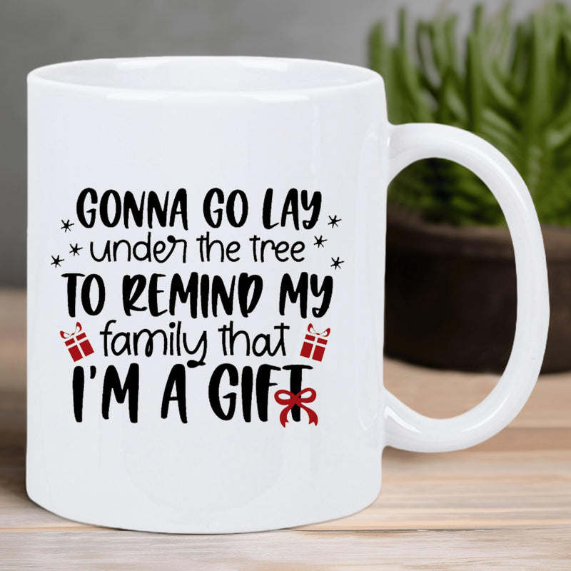 Tailorly White Ceramic 11 oz Mug - Gonna Go Lay Under The Tree To Remind My Family That I'm A Gift Minimalist Black Lettering With Red Ribbon Gift Box And Stars