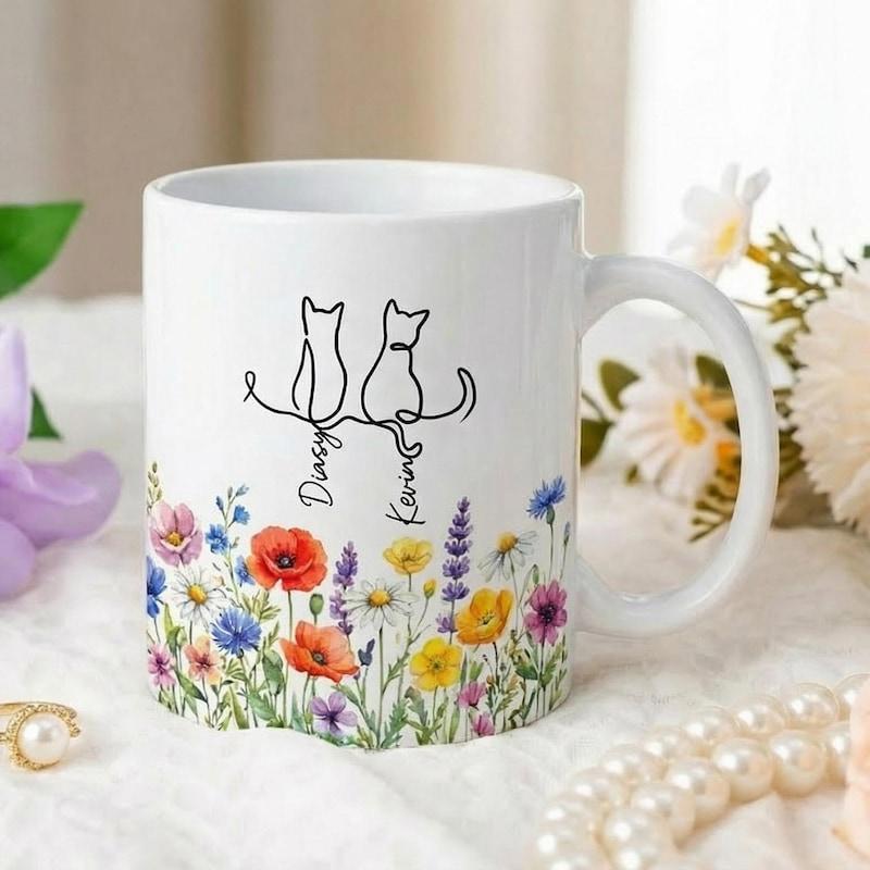 Tailorly White Ceramic 11 oz Mug - Daisy Kona Minimalist Cat Line Art Above A Vibrant Colorful Wildflower Garden Mug