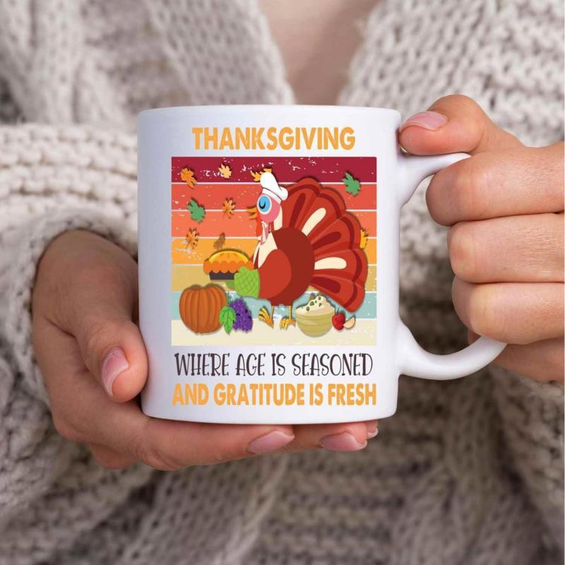 Tailorly White Ceramic 11 oz Mug - Thanksgiving Where Age Is Seasoned And Gratitude Is Fresh Festive Cartoon Scene Featuring Harvest Pumpkins And Autumn Leaves
