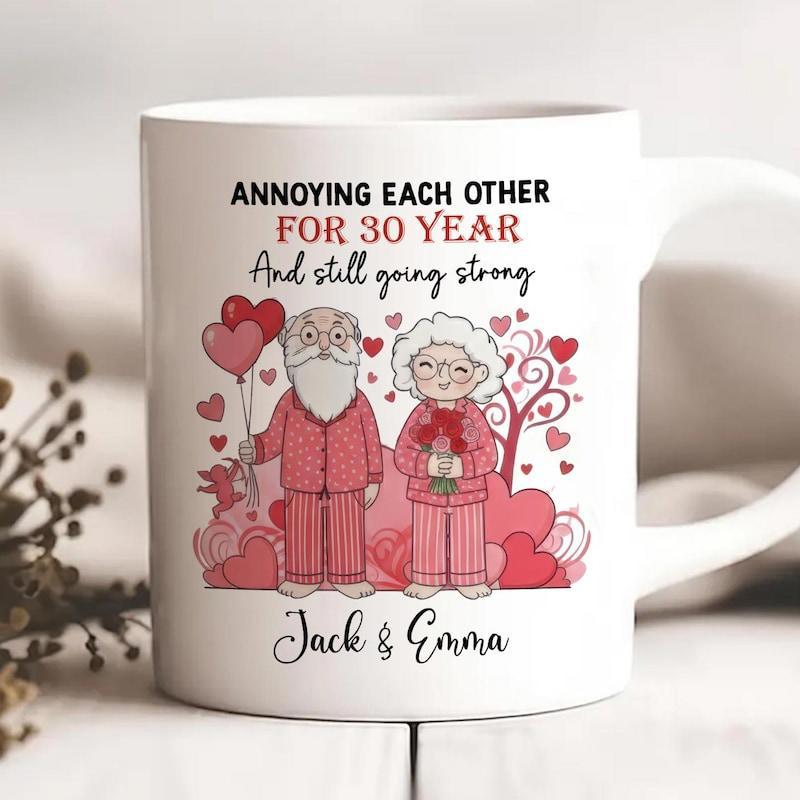 Tailorly White Ceramic 11 oz Mug - Annoying Each Other For 30 Year And Still Going Strong Jack Emma Cartoon Elderly Couple Holding Heart Balloons Surrounded By