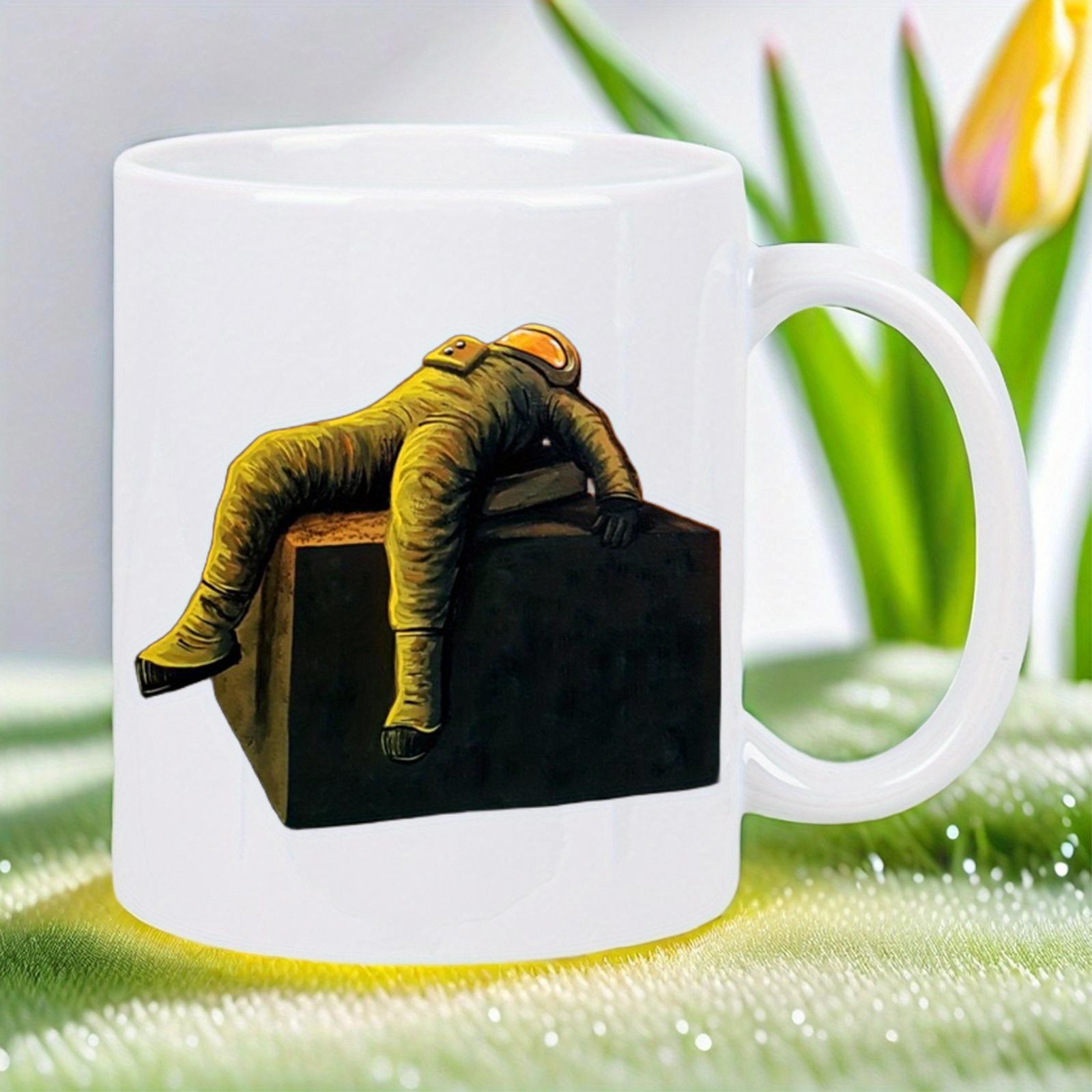 Tailorly White Ceramic 11 oz Mug - Tired Gold Space Suit Slumping Over Black Monolith Cube Design Astronaut