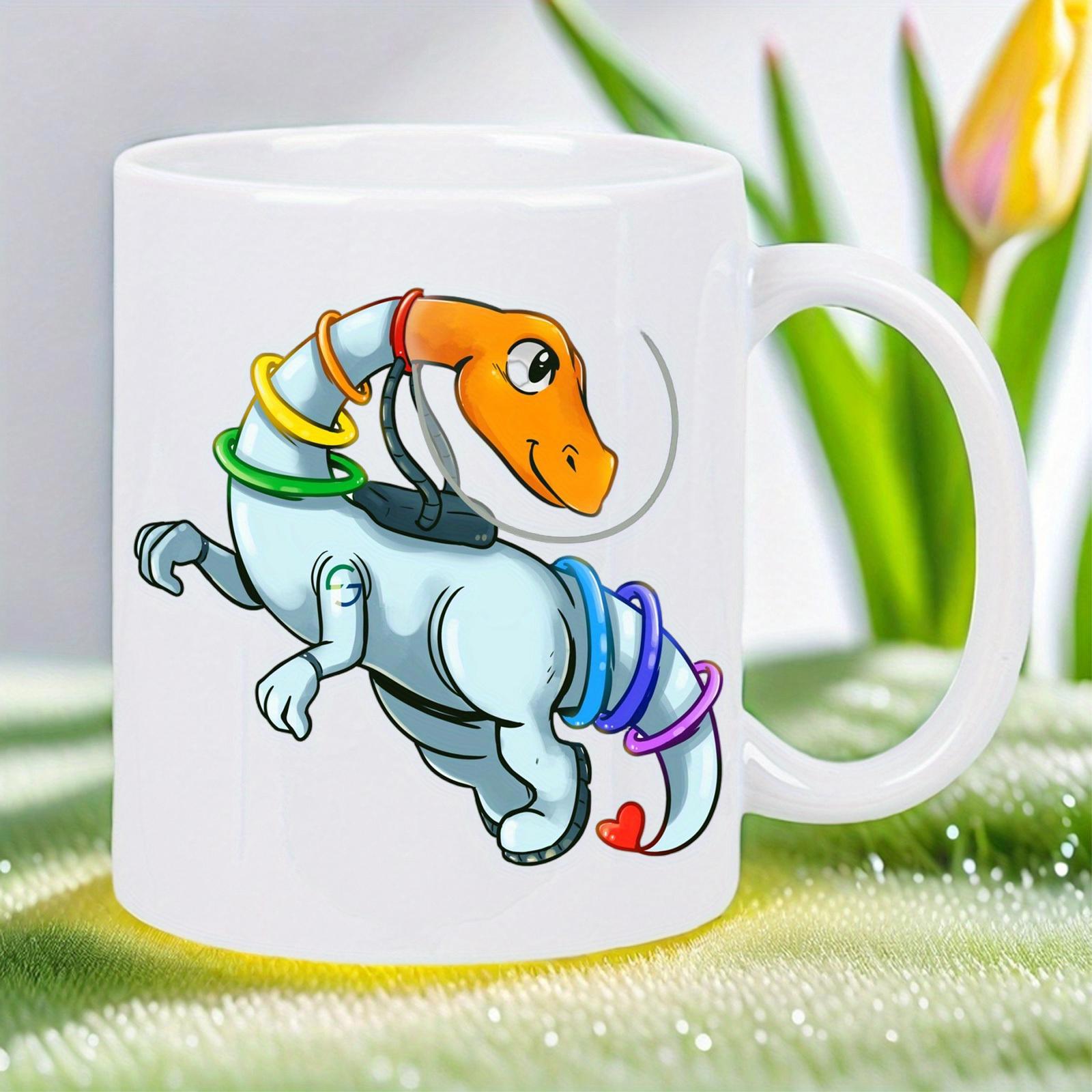 Tailorly White Ceramic 11 oz Mug - Friendly Light Blue Body Wearing Vibrant Colorful Rings Playful Dinosaur