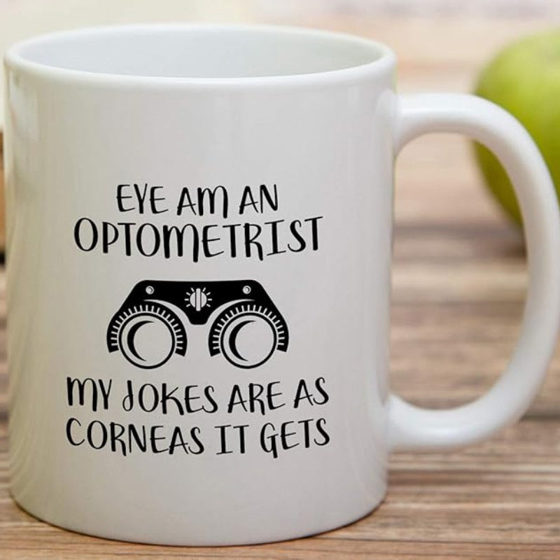 Tailorly White Ceramic 11 oz Mug - Eye Am An Optometrist My Jokes Are As Corneas It Gets Simple Black Medical Icon Centered On A Smooth White Surface Phoropter