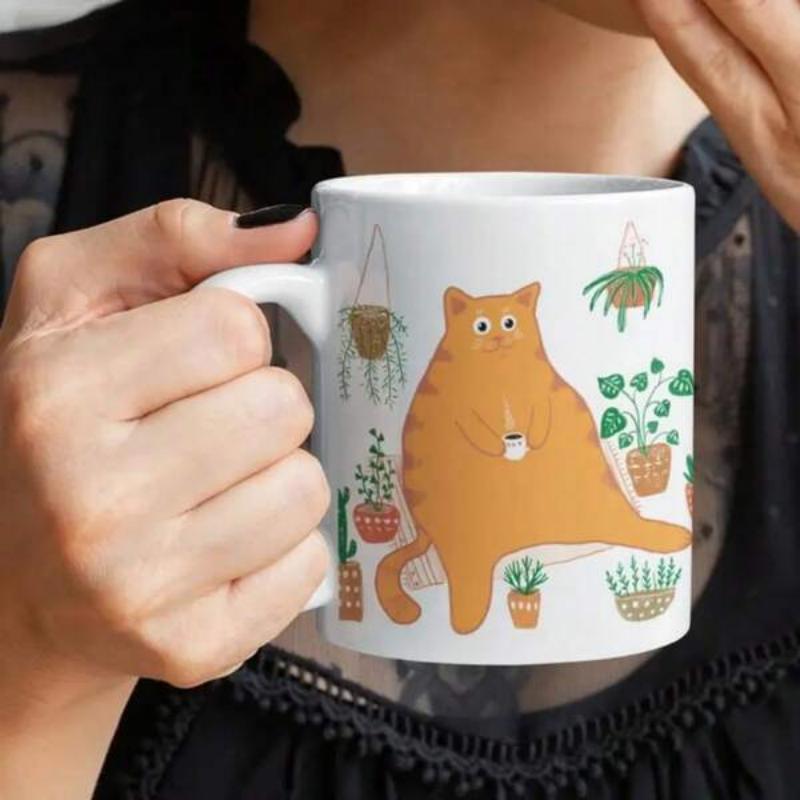 Tailorly White Ceramic 11 oz Mug - Chubby Orange Tabby Relaxing Among Many Potted House Plants Holding Coffee Mug Cat