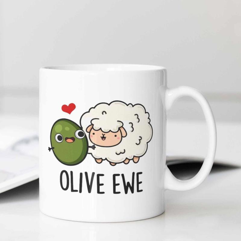 Tailorly White Ceramic 11 oz Mug - Olive Ewe Smiling Green Olive Standing Next To A Fluffy White Curly Sheep
