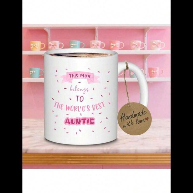 Tailorly White Ceramic 11 oz Mug - This Mug Belongs To The World's Best Auntie Minimalist Pink Ribbon Banner With Festive Confetti Scattered Across A Mug