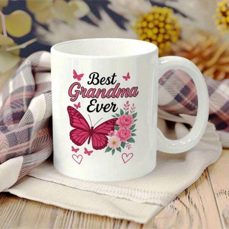 Tailorly White Ceramic 11 oz Mug - Best Grandma Ever Vibrant Pink Wings Resting Beside Blooming Floral Bouquet And Small Flying Butterfly
