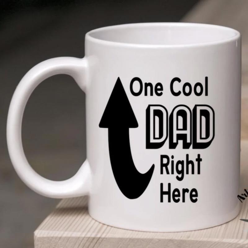 Tailorly White Ceramic 11 oz Mug - One Cool Dad Right Here Solid Black Curved Arrow Pointing Upward On White Minimalist Surface Arrow