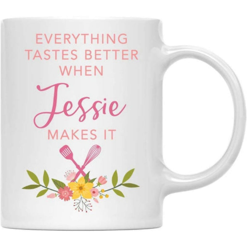 Tailorly White Ceramic 11 oz Mug - Everything Tastes Better When Jessie Makes It Crossed Pink Kitchen Spatulas Resting Above A Colorful Floral Bouquet Mug