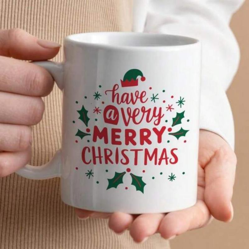 Tailorly White Ceramic 11 oz Mug - Have A Very Merry Christmas Festive Decorative Green Holly Leaves And Tiny Whimsical Seasonal Red Elf Hat Christmas