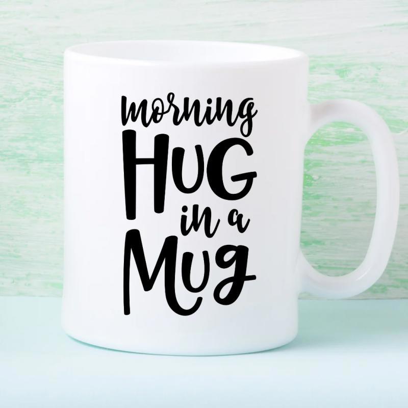 Tailorly White Ceramic 11 oz Mug - Morning Hug In A Mug Clean White Minimalist Surface Featuring Bold Handwritten Styled Black Font Mug