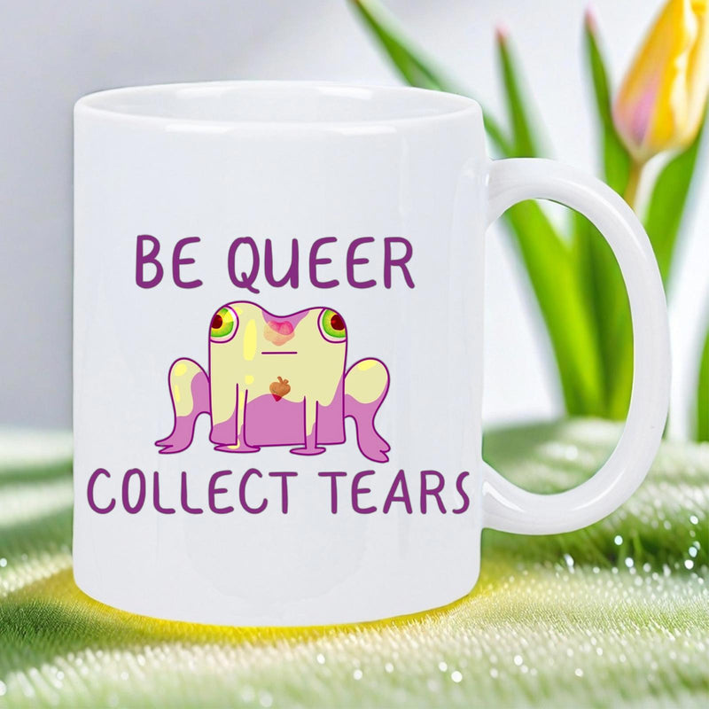 Tailorly White Ceramic 11 oz Mug - Be Queer Collect Tears Vibrant Pink And Yellow Cartoon Creature Sitting Peacefully Frog
