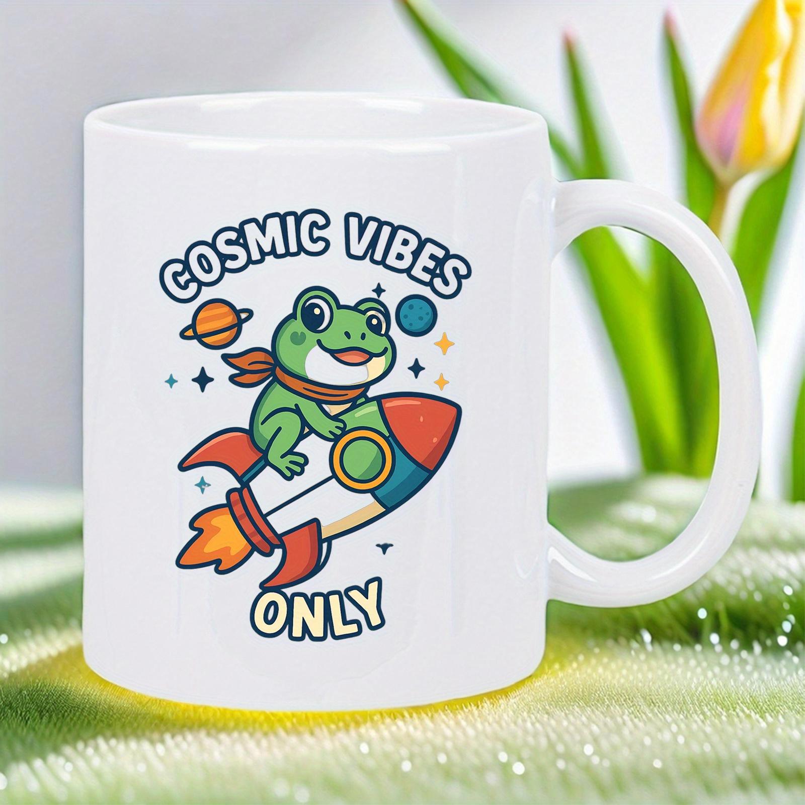 Tailorly White Ceramic 11 oz Mug - Cosmic Vibes Only Playful Cartoon Frog Riding Colorful Rocket Ship Through The Stars And Planets Frog