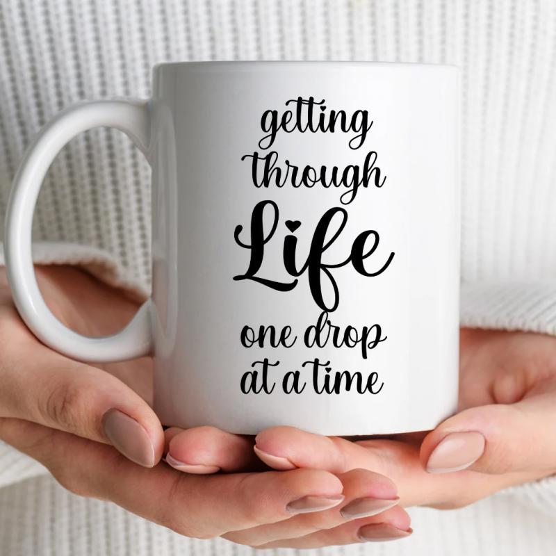 Tailorly White Ceramic 11 oz Mug - Getting Through Life One Drop At A Time Simple White Ceramic Vessel Featuring An Inspirational Message And Heart Mug