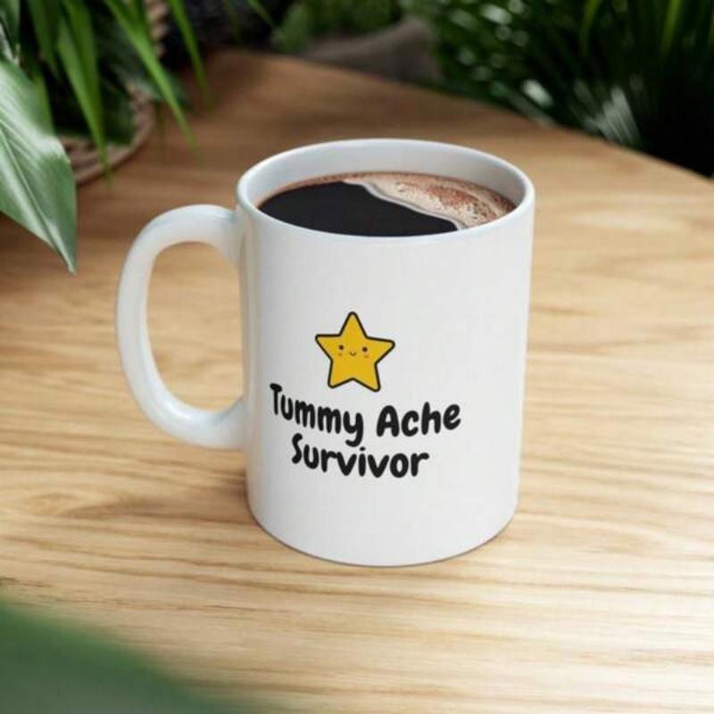 Tailorly White Ceramic 11 oz Mug - Tummy Ache Survivor Cute Yellow Cartoon Character Smiling Under A Bright Golden Celestial Star