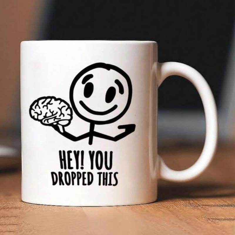 Tailorly White Ceramic 11 oz Mug - Hey You Dropped This Minimalist Black Line Art Smiling Figure Holding A Human Brain Stickman