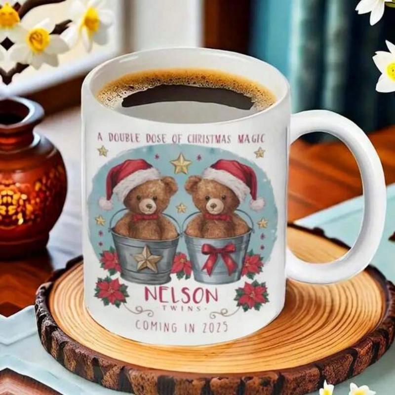 Tailorly White Ceramic 11 oz Mug - A Bundle Full Of Christmas Magic Nelson Twins Coming In 2023 Two Adorable Festive Bears Sitting In Buckets Wearing Red Santa