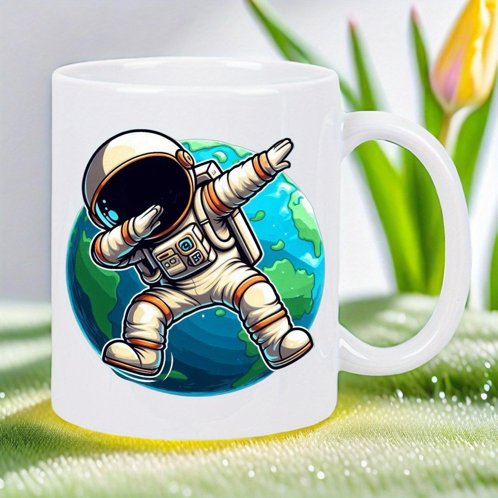 Tailorly White Ceramic 11 oz Mug - Whimsical Cartoon Character Dabbing In Front Of A Lush Green Earth Astronaut
