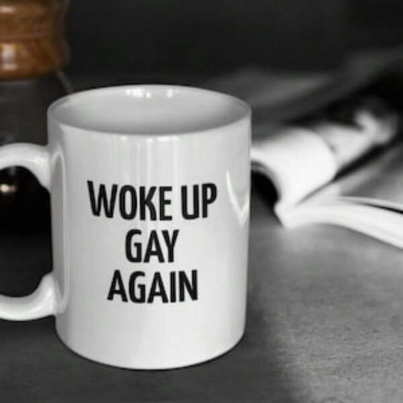 Tailorly White Ceramic 11 oz Mug - Woke Up Gay Again Simple White Ceramic Vessel Standing On Table Next To Open Book Mug